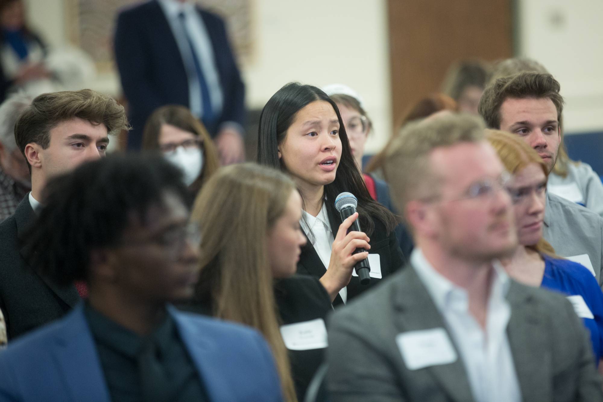 student asking question at event